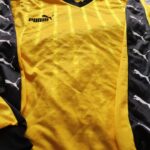 Koszulka piłkarska Puma Torceira template w kolorze żółto-czarnym marki Puma.