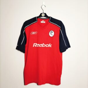 Wyjazdowa koszulka piłkarska Bolton Wanderers z lat 2003-05 w kolorze czerwono-granatowym marki Reebok.
