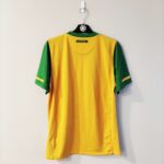 Domowa koszulka Australia z sezonu 2010-11 w kolorze żółto-zielonym marki Nike.