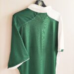 Wyjazdowa koszulka Walia z lat 2012-13 w kolorze biało-zielonym marki Umbro.