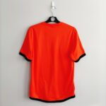 Domowa koszulka Holandia z lat 2012-13 w kolorze pomarańczowym marki Nike.
