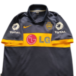 Koszulka domowa Boca Juniors z sezonu 2009-10 w kolorze granatowo-żółtym marki Nike.
